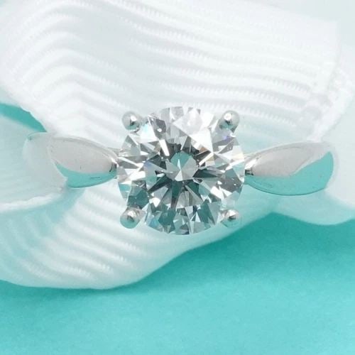 TIFFANY & CO. HARMONY PLATINUM 1.06CT DIAMOND H VS2 ENGAGAMENT RING SIZE 5 PAPER: TIFFANY & CO. HARMONY PLATINUM 1.06CT DIAMOND H VS2 ENGAGAMENT RING SIZE 5 PAPER Tiffany & Co. Tiffany Harmony Platinum Round Brilliant Diamond Engagement Ring Size - 5 Band Width - 2mm Diamond Carat 