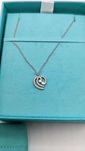 TIFFANY & CO. PLATINUM DIAMOND HEART PENDANT NECKLACE - 16" LONG: Tiffany & Co. Platinum Diamond Heart Pendant Necklace Length - 16" Long Pendant Size - 10mm Total Weight - 3.1 Grams Excellent Condition & Very Well Kept Box & Pouch Included