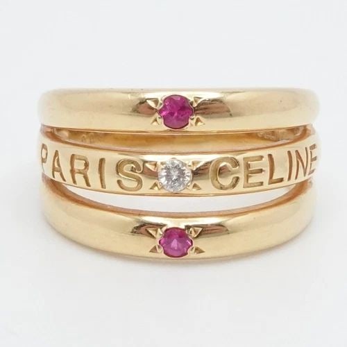 CELINE PARIS 18K YELLOW GOLD DIAMOND & RUBY BAND RING - SIZE 6.75: CELINE PARIS 18K YELLOW GOLD DIAMOND & RUBY BAND RING - SIZE 6.75 Celine Paris 18K Yellow Gold Diamond & Ruby Band Ring Ring Size - 6.75 Total Weight - 7.0 Grams Width - 3.5mm - 11mm Great Condition &