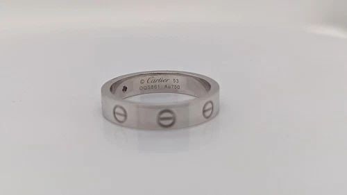 CARTIER LOVE WEDDING 4MM BAND 1 DIAMOND RING 18K WHITE GOLD - SIZE 53 / 6.25: Cartier Love Wedding Band 1 Diamond Ring 18K White Gold Ring Size - 53 / 6.25 Width - 4mm Total Weight - 5.4 Grams Diamond Size - 0.02 Carats Retail Price - $2530.00 + Tax Pouch & Proof of Purchase In