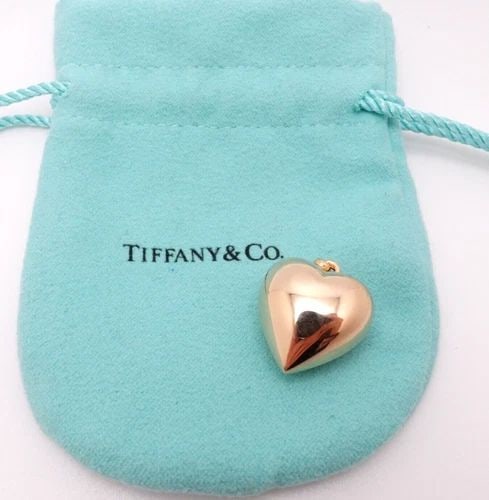 TIFFANY & CO. 14K YELLOW GOLD PUFFY HEART PENDANT 19MM: Tiffany & Co. 14K Yellow Gold Puffy Heart Pendant Total Weight - 3.1 Grams Height - 21mm Width - 19mm Depth - 12mm Pouch NOT Included