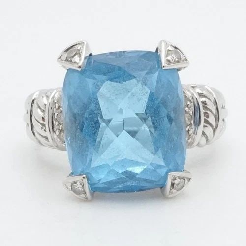 14K WHITE GOLD BLUE TOPAZ & DIAMOND COCKTAIL RING SIZE 7: 14K WHITE GOLD BLUE TOPAZ & DIAMOND COCKTAIL RING SIZE 7 14K White Gold Blue Topaz & Diamond Cocktail Ring Size - 7 Band Width - 3mm Gemstone Size - 12.5mm x 11mm Total Weight - 7.7 Grams