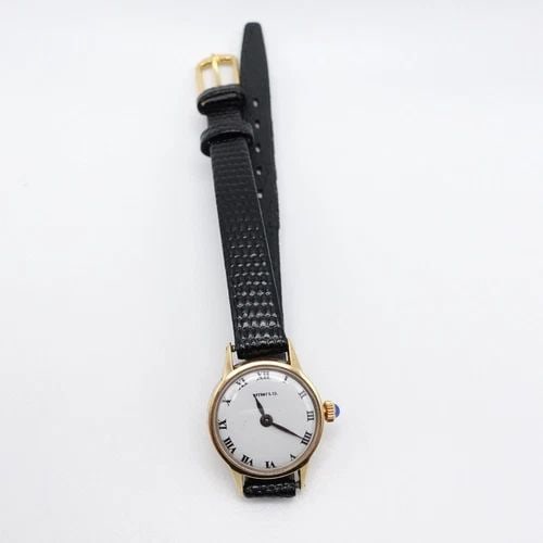 TIFFANY & CO. 14K YELLOW GOLD MANUAL WIND WATCH 18.5MM: Tiffany & Co. 14K Yellow Gold Manual Wind Watch with aftermarket genuine leather strap Case Size - 18.5mm Total Length - 7.75" Long Back Case # 2032261 306453 Box or Papers NOT Included
