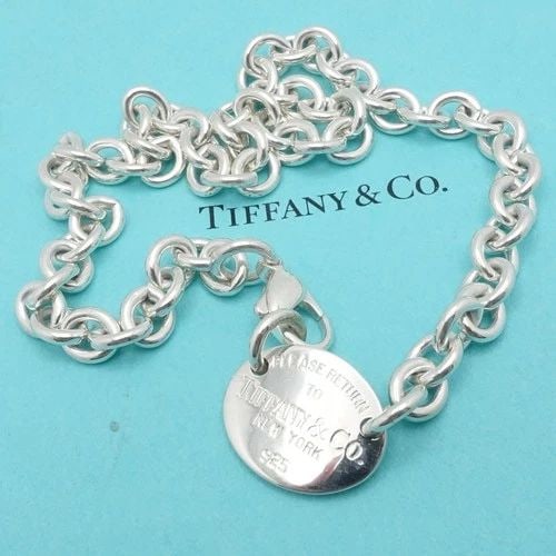 TIFFANY & CO. RETURN TO STERLING SILVER OVAL TAG CHAIN NECKLACE 15": TIFFANY & CO. RETURN TO STERLING SILVER OVAL TAG CHAIN NECKLACE 15" Tiffany & Co. Return To Sterling Silver Oval Tag Chain Necklace Length - 15" Chain Width - 8mm Depth - 2mm Thick Pendant Size - 18mm