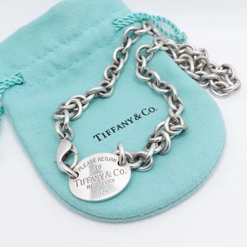 TIFFANY & CO. RETURN TO STERLING SILVER OVAL TAG CHOKER NECKLACE - 15.5": Tiffany & Co. Return To Sterling Silver Oval Tag Choker Necklace Length - 15.5" Chain Width - 8mm Tag Size - 0.85" x 0.7" Est. Retail - $900 USD Total Weight - 50.7 Grams Pouch NOT Included