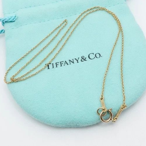 TIFFANY & CO. PERETTI 18K YELLOW GOLD 1MM CABLE CHAIN DAINTY NECKLACE 16.25": Tiffany & Co. Elsa Peretti 18K Yellow Gold Cable Chain Necklace with 14K Yellow Gold Bail Length - 16.25" Long Chain Width - 1mm approx. Total Weight - 1.6 Grams *Spring clasp is 14K & the chain itsel