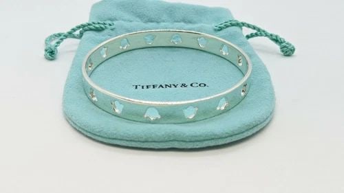TIFFANY & CO. STERLING SILVER BANGLE BRACELET - ITALY - 7.5" WRIST: Tiffany & Co. Sterling Silver Bangle Bracelet - ITALY - Fits Up to 7.5" Wrist Width - 8.2mm Total Weight - 20.7 Grams Professionally Polished & Looks Brand New Pouch NOT Included