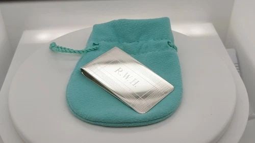 TIFFANY & CO. STERLING SILVER MONEY CLIP - 2.25" X 1.25" ETCHED: Tiffany & Co. Sterling Silver Money Clip Dimensions - 2.25" Long x 1.25" Wide Total Weight - 30.4 Grams Professionally Polished & Looks Like New Engraved On Front Pouch Included