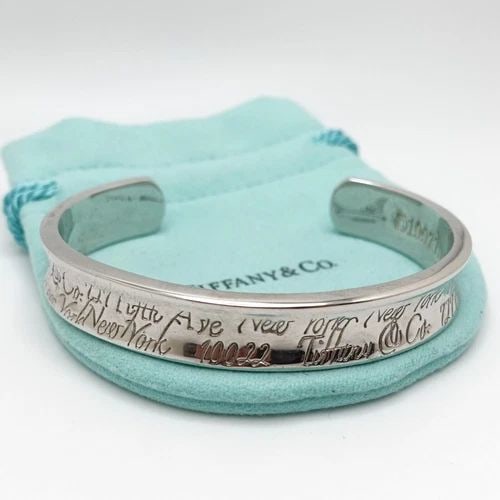 1997 TIFFANY & CO. NOTES STERLING SILVER FIFTH AVE CONCAVE CUFF BRACELET SZ 6.75: Tiffany & Co. Notes Sterling Silver Fifth Ave Concave Cuff Bracelet Size - 6.75" Max Wrist Size w/o Gap - 5.5" Width - 11mm Diameter - 2.4" Total Weight - 34.6 Grams