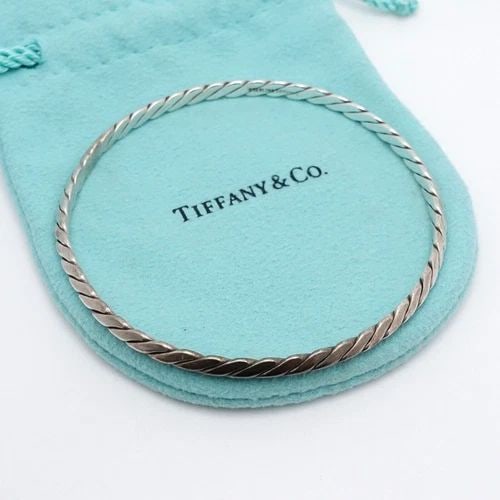 TIFFANY & CO. STERLING SILVER 4MM TWIST ROPE BANGLE BRACELET - 7.5" WRIST #Q2: TIFFANY & CO. STERLING SILVER 4MM TWIST ROPE BANGLE BRACELET - 7.5" WRIST #Q2 Tiffany & Co. Sterling Silver Twist Rope Knife Edge Bangle Bracelet Fits up to 7.5" Wrist Width - 4mm Total Weight - 12 Gr