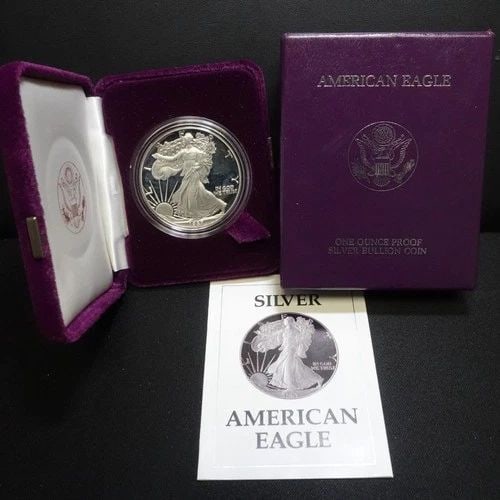 1987 S U.S MINT AMERICAN EAGLE 1 OZ SILVER PROOF DOLLAR COA & BOX #Q2: 1987 S U.S MINT AMERICAN EAGLE 1 OZ SILVER PROOF DOLLAR COA & BOX #Q2 1987 S U.S Mint American Eagle 1 Troy Oz. Silver Proof Dollar COA & Box With Purple Velvet Case Included *Tarnish toning on the ed