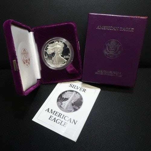 1987 S U.S MINT AMERICAN EAGLE 1 OZ SILVER PROOF DOLLAR COA & BOX #Q1: 1987 S U.S MINT AMERICAN EAGLE 1 OZ SILVER PROOF DOLLAR COA & BOX #Q1 1987 S U.S Mint American Eagle 1 Troy Oz. Silver Proof Dollar COA & Box With Purple Velvet Case Included *Signs of scuffs on corne