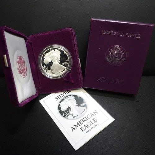 1990 S U.S MINT AMERICAN EAGLE 1 OZ SILVER PROOF DOLLAR COA & BOX #Q1: 1990 S U.S MINT AMERICAN EAGLE 1 OZ SILVER PROOF DOLLAR COA & BOX #Q1 1990 S U.S Mint American Eagle 1 Troy Oz. Silver Proof Dollar #Q1 COA & Box With Purple Velvet Case Included *Signs of dent/scuff 