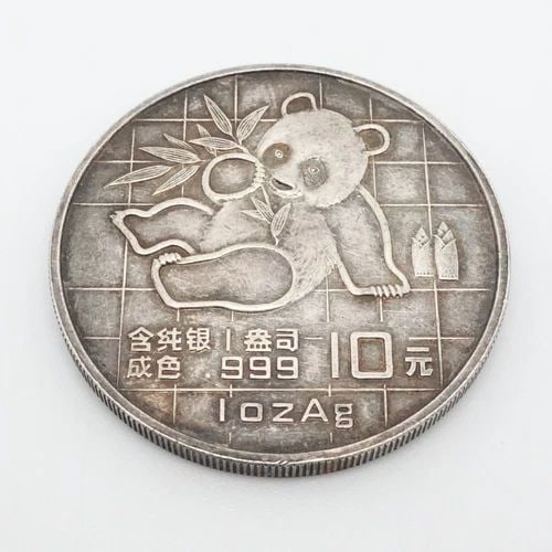 1989 CHINA PANDA 1 OZ. SILVER 10 YUAN COIN: 1989 CHINA PANDA 1 OZ. SILVER 10 YUAN COIN 1989 China Panda Silver 10 Yuan Coin Composition - .999 Silver Diameter - 40mm Depth - 3.42mm Thick Total Weight - 31.1 Grams Unsealed - As Is