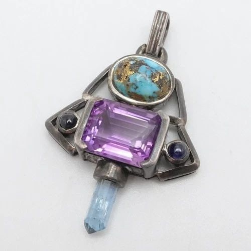 STERLING SILVER MULTI GEMSTONE TURQUOISE AMETHYST IOLITE TOPAZ PENDANT 2": STERLING SILVER MULTI GEMSTONE TURQUOISE AMETHYST IOLITE TOPAZ PENDANT 2" Sterling Silver Multi Gemstone Turquoise Amethyst Iolite and Blue Topaz Asymmetrical Pendant Height - 2" Width - 1.33" Total W