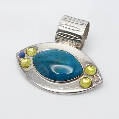 JAY KING DTR STERLING SILVER CHRYSOCOLLA PERIDOT LAPIS EYE PENDANT 1.25": Jay King Desert Rose Trading Company Signed DTR Sterling Silver Chrysocolla Peridot Lapis Eye Pendant Height - 1.25" Width - 1.75" Bail Width - 14mm Center Gemstone Size - 21mm x 25mm Total Weight - 1