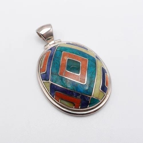 SILVER 950 PERU MULTI GEMSTONE INLAY OVAL PENDANT - 2.25": SILVER 950 PERU MULTI GEMSTONE INLAY OVAL PENDANT - 2.25" Silver 950 Peru Multi Gemstone Inlay Oval Pendant Height - 2.25" Length - 1.40" Bail Height - 8mm Bail Width - 6.5mm Total Weight - 32 Grams