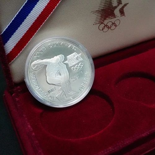 1983 S U.S MINT OLYMPIC SILVER PROOF $1 DOLLAR OGP & COA: 1983 S U.S MINT OLYMPIC SILVER PROOF $1 DOLLAR OGP & COA 1983 S U.S Mint Olympic Silver Proof $1 Dollar **Missing 1 Gold & 1 Silver Coin** OGP & Silver COA ONLY Included