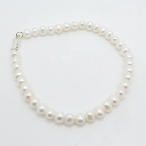 STERLING SILVER WHITE BAROQUE CULTURED PEARL CORD BRACELET 7.5" LONG: STERLING SILVER WHITE BAROQUE CULTURED PEARL CORD BRACELET 7.5" LONG Sterling Silver White Baroque Cultured Pearl Cord Bracelet Length - 7.5" Long Wrist - 7" Pearl Width - 5.5mm Total Weight - 7.4