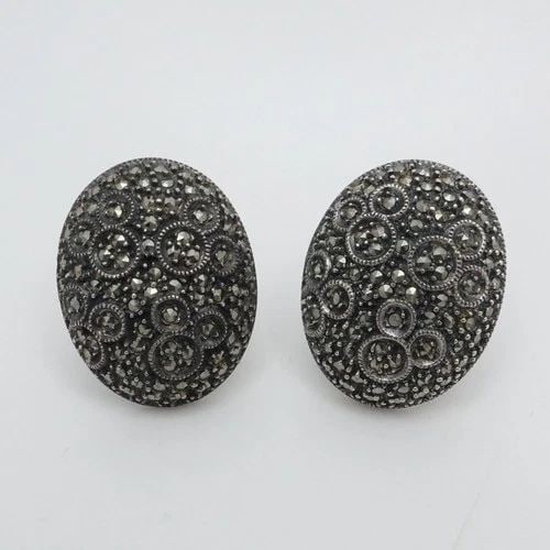 DISNEY JJ SIGNED STERLING SILVER MARCASITE OVAL OMEGA BACK DROP EARRINGS: DISNEY JJ SIGNED STERLING SILVER MARCASITE OVAL OMEGA BACK DROP EARRINGS Disney JJ Signed Sterling Silver Marcasite Oval Omega Back Drop Earrings Length - 1.1" Width - 0.80" Total Weight - 19.7 Grams 