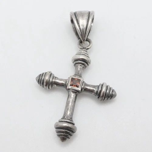 STERLING SILVER ORANGE GARNET CROSS PENDANT 2.5": STERLING SILVER ORANGE GARNET CROSS PENDANT 2.5" Sterling Silver Orange Garnet Cross Pendant Total Length - 2.5" Bail Size (HxW) - 12mm x 8mm Gemstone Size - 4mm Total Weight - 17.5 Grams