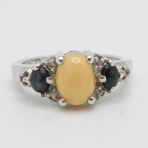 STERLING SILVER OVAL OPAL THREE STONE RING SIZE 7.25: STERLING SILVER OVAL OPAL THREE STONE RING SIZE 7.25 Sterling Silver Oval Opal Three Stone Ring Size - 7.25 Band Width - 2mm Main Stone Height - 8mm Total Weight - 3.1Grams