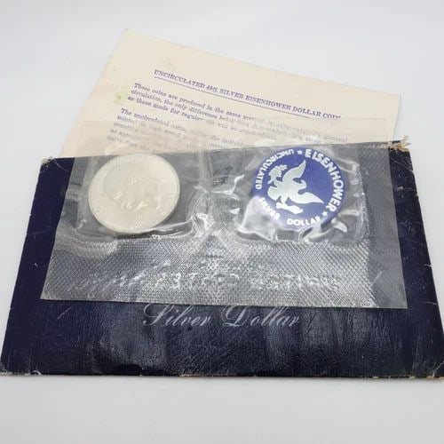 1971 S U.S MINT EISENHOWER UNCIRCULATED SILVER DOLLAR COIN OGP COA: 1971 S U.S MINT EISENHOWER UNCIRCULATED SILVER DOLLAR COIN OGP COA 1971-S U.S Mint Eisenhower Uncirculated 40% Silver Dollar Coin Sealed in Blue Mint Envelope OGP & COA Included