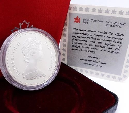 1984 TORONTO QUEEN ELIZABETH II PROOF COMMEM CANADA SILVER DOLLAR - OGP COA: 1984 TORONTO QUEEN ELIZABETH II PROOF COMMEM CANADA SILVER DOLLAR - OGP COA 1984 Toronto Queen Elizabeth II Proof Commemorative .500 Silver Canada $1 Dollar COA & Box Included