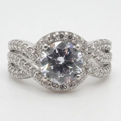 KIERA STERLING SILVER ROUND CLEAR CZ CUBIC ZIRCONIA INTERTWINE RING SIZE 8.25: KIERA STERLING SILVER ROUND CLEAR CZ CUBIC ZIRCONIA INTERTWINE RING SIZE 8.25 Kiera Sterling Silver Round Clear Cubic Zirconia Intertwine Ring Size - 8.25 Band Width - 3.5mm Total Weight - 6.6 Grams H