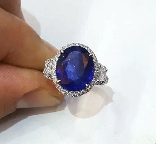 PLATINUM ENGAGEMENT RING 7.59CT. NATURAL GEM BLUE SAPPHIRE OVAL CUT: PLATINUM ENGAGEMENT RING 7.59CT. NATURAL GEM BLUE SAPPHIRE OVAL CUT Platinum sapphire ring Center stone Natural heated blue sapphire sapphire oval shape size 12.8X10.6x5.5mm weight 6.61ct. CERT. clean