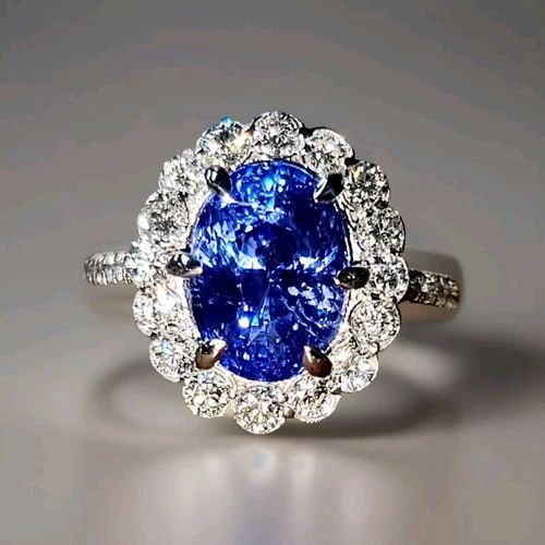 14K WHITE GOLD ENGAGEMENT RING 3.12CT. NATURAL UNTREATED BLUE SAPPHIRE OVAL CUT: 14K WHITE GOLD ENGAGEMENT RING 3.12CT. NATURAL UNTREATED BLUE SAPPHIRE OVAL CUT This stunning engagement ring is crafted from 14K white gold and features a gorgeous oval-cut blue sapphire gemstone, su