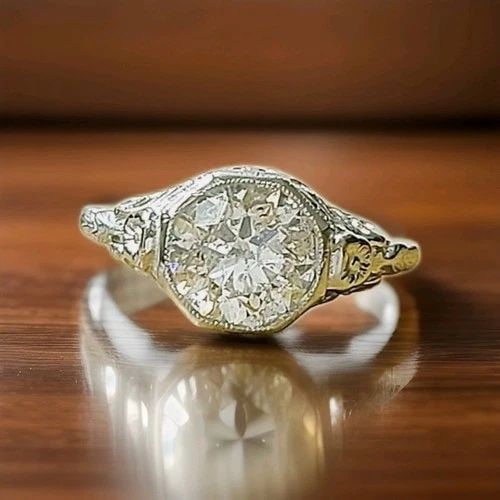 PLATINUM VINTAGE FILIGREE ENGAGEMENT RING 2.32CT. NATURAL ROUND DIAMOND 1930'S: PLATINUM VINTAGE FILIGREE ENGAGEMENT RING 2.32CT. NATURAL ROUND DIAMOND 1930'S This enchanting Art Deco engagement ring captures the romance of a bygone era, featuring a natural 2.32-carat round diamo