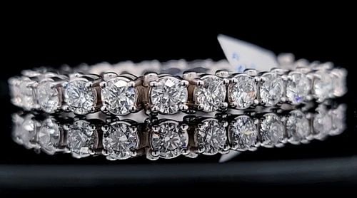 14K WHITE GOLD 20.26CT. LAB GROWN ROUND DIAMONDS TENNIS BRACELET: 14K WHITE GOLD 20.26CT. LAB GROWN ROUND DIAMONDS TENNIS BRACELET This stunning 14k white gold tennis bracelet features a total of 27 lab-grown round diamonds, with a total carat weight of 20.26. The d