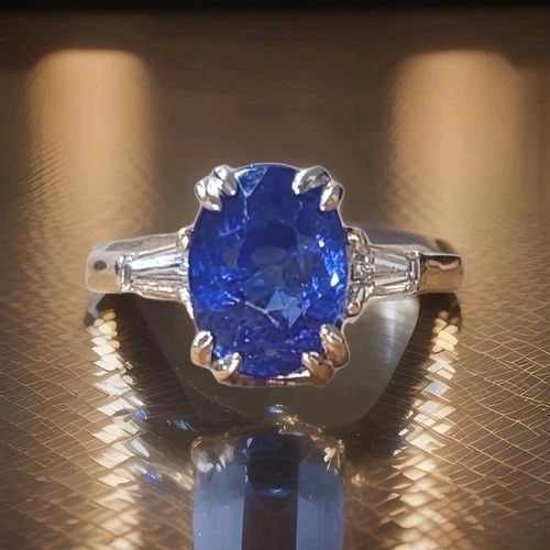 VINTAGE PLATINUM ENGAGEMENT RING 4.51CT. NATURAL OVAL BLUE SAPPHIRE GIA CERT: VINTAGE PLATINUM ENGAGEMENT RING 4.51CT. NATURAL OVAL BLUE SAPPHIRE GIA CERT This vintage platinum engagement ring is a stunning piece of fine jewelry that will capture her heart. The ring features a 