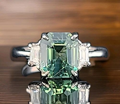 VINTAGE 14K WHITE GOLD ENGAGEMENT RING 3.00CT.UNTREATED TEAL SAPPHIRE GIA CERT: VINTAGE 14K WHITE GOLD ENGAGEMENT RING 3.00CT.UNTREATED TEAL SAPPHIRE GIA CERT This stunning vintage 14K white gold engagement ring features a rare natural untreated teal blue-green sapphire in a radi