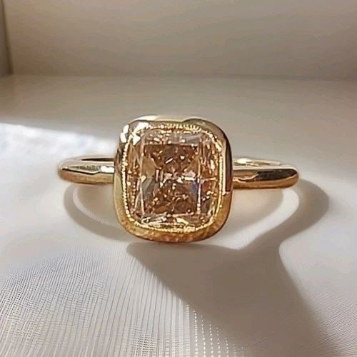 14K YELLOW GOLD ENGAGEMENT RING 2.63CT.NATURAL CUSHION CUT CHAMPAGNE DIAMOND: 14K YELLOW GOLD ENGAGEMENT RING 2.63CT.NATURAL CUSHION CUT CHAMPAGNE DIAMOND This exquisite vintage ring is crafted in solid 14K yellow gold and showcases a beautiful natural champagne diamond at its 