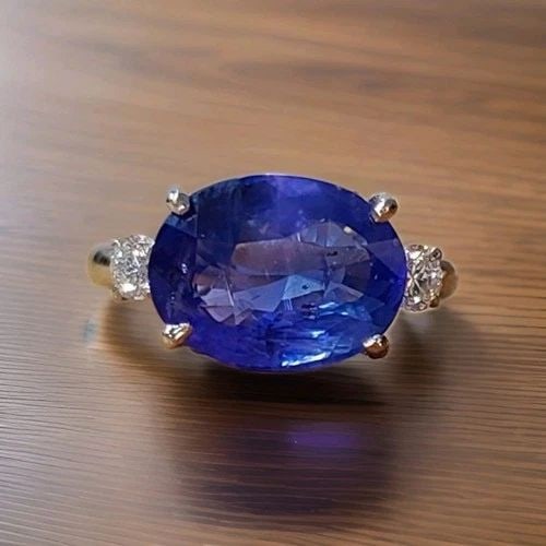 VINTAGE PLATINUM ENGAGEMENT RING 5.03CT.NATURAL UNTREATED BLUE OVAL SAPPHIRE GIA: VINTAGE PLATINUM ENGAGEMENT RING 5.03CT.NATURAL UNTREATED BLUE OVAL SAPPHIRE GIA This Vintage Platinum Engagement Ring features a stunning 5.03CT Natural Untreated Blue Oval Sapphire as the main stone