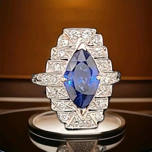 VINTAGE 14K WHITE GOLD RING 3.74CT. NATURAL BLUE SAPPHIRE MARQUISE CUT GIA CERT: VINTAGE ART DECO 14K WHITE GOLD RING 3.74CT. NATURAL BLUE SAPPHIRE MARQUISE CUT This stunning vintage Art Deco ring is crafted from 14k white gold and features a magnificent 3.74ct natural blue sapphi
