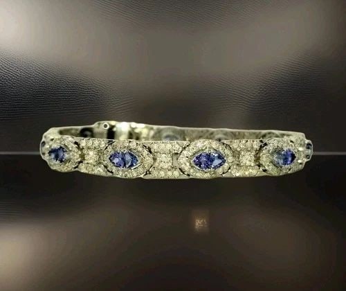 18K WHITE GOLD NATURAL TANZANITE & DIAMOND BRACELET – 6.24CTW, 7 INCHES: 18K WHITE GOLD BRACELET NATURAL TANZANITE DIAMOND 6.24CT. GORGEOUS 18K WHITE GOLD DIAMOND TANZANITE BRACELET SET WITH NATURAL TANZANITE TOTAL WEIGHT 4.05 carats SET WITH NATURAL DIAMONDS 2.19CT TW. TH