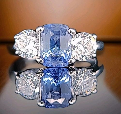 14K WHITE GOLD ENGAGEMENT RING 2.54CT. NATURAL UNTREATED BLUE SAPPHIRE CUSHION: 14K WHITE GOLD ENGAGEMENT RING 2.54CT. NATURAL UNTREATED BLUE SAPPHIRE CUSHION This 14K White gold Engagement Ring features a stunning 2.54ct natural untreated blue sapphire in a cushion shape, making