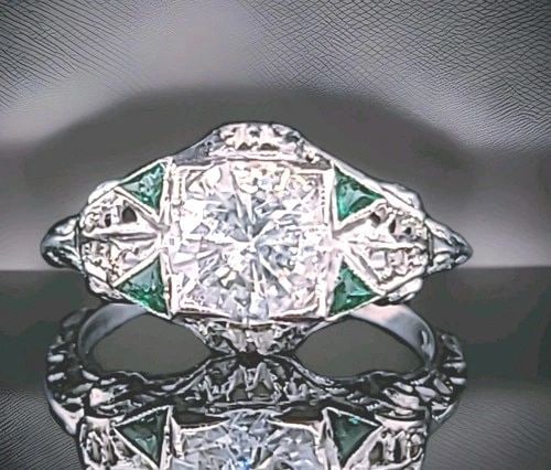 20K WHITE GOLD VINTAGE FILIGREE ENGAGEMENT RING 1.26CT NATURAL ROUND DIAMOND: 20K WHITE GOLD VINTAGE FILIGREE ENGAGEMENT RING 1.26CT NATURAL ROUND DIAMOND This vintage 20k white gold engagement ring features a beautiful 1.26ct natural round diamond as the main stone, set in a c