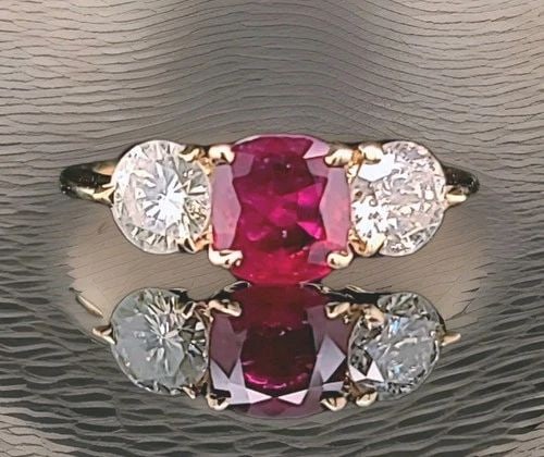 VINTAGE 14K YELLOW GOLD ENGAGEMENT THREE-STONES RING 1.16CT.NATURAL CUSHION RUBY: VINTAGE 14K YELLOW GOLD ENGAGEMENT THREE-STONES RING 1.16CT.NATURAL CUSHION RUBY This gorgeous vintage engagement ring is crafted in solid 14K yellow gold and features a natural cushion-cut ruby weigh