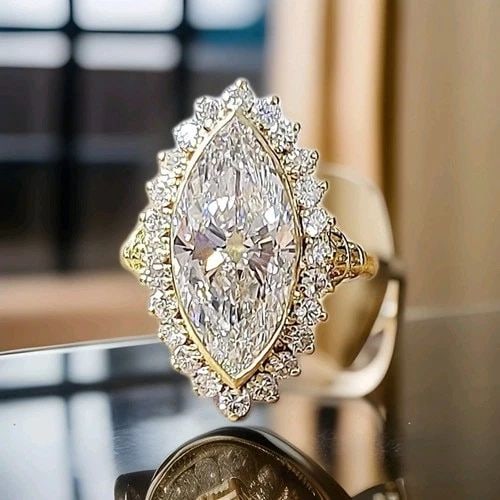 VINTAGE 18K YELLOW GOLD ENGAGEMENT RING 5.06CT.LAB-GROWN MARQUISE EURO DIAMOND: VINTAGE 18K YELLOW GOLD ENGAGEMENT RING 5.06CT.LAB-GROWN MARQUISE EURO DIAMOND This Vintage 18k Yellow Gold Engagement Ring features a stunning 5.06ct Lab-Grown Marquise Euro Diamond as the main stone
