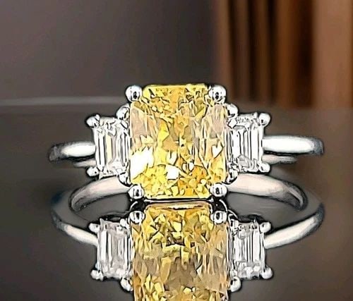 14K WHITE GOLD ENGAGEMENT RING 3.02CT.NATURAL YELLOW RADIANT SAPPHIRE GIA CERT: 14K WHITE GOLD ENGAGEMENT RING 3.02CT.NATURAL YELLOW RADIANT SAPPHIRE GIA CERT Here is an outstanding natural yellow sapphire engagement ring, the beautiful three-stone yellow sapphire design gives th