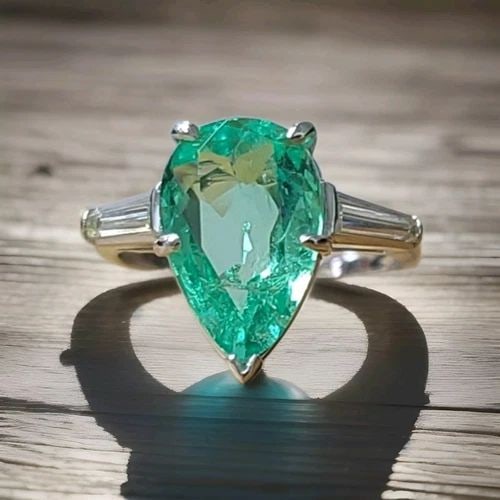 VINTAGE PLATINUM ENGAGEMENT RING 3.16CT. NATURAL COLOMBIA MINT EMERALD PEAR CUT: VINTAGE PLATINUM ENGAGEMENT RING 3.16CT. NATURAL COLOMBIA MINT EMERALD PEAR CUT This vintage engagement ring is a stunning piece of fine jewelry that will capture everyone's attention. The ring featur