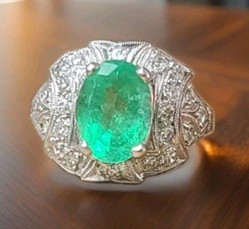 VINTAGE FILIGREE PLATINUM ENGAGEMENT RING 1.88CT. NATURAL COLOMBIA EMERALD OVAL: VINTAGE FILIGREE PLATINUM ENGAGEMENT RING 1.88CT. NATURAL COLOMBIA EMERALD OVAL An exquisite circa 1930s vintage platinum filigree ring centered by a stunning 1.88-carat natural oval Colombian emerald