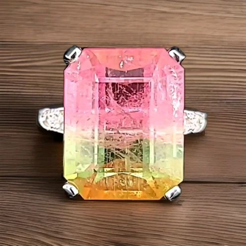 VINTAGE 14K WHITE GOLD ENGAGEMENT RING 15.67CT.NATURAL BIO TOURMALINE: VINTAGE 14K WHITE GOLD ENGAGEMENT RING15.67CT.NATURAL BIO TOURMALINE EMERALD CUT This vintage 14k white gold engagement ring features a stunning 15.67CT natural bio tourmaline gemstone with an emerald