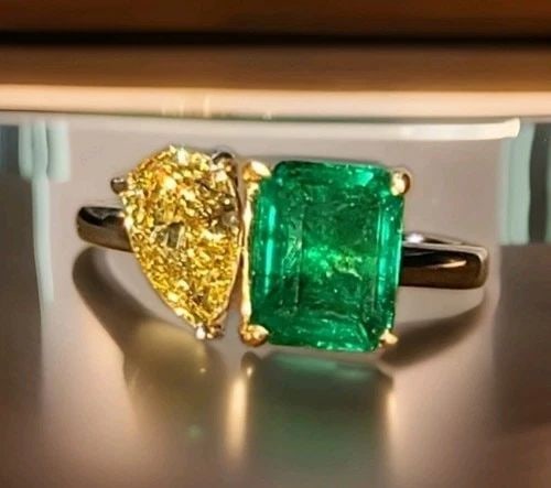 14K WHITE GOLD RING 2.55CT. NATURAL GREEN EMERALD YELLOW PEAR SHAPE DIAMOND: 14K WHITE GOLD RING 2.55CT. NATURAL GREEN EMERALD YELLOW PEAR SHAPE DIAMOND This 14k White Gold Ring features a stunning total 2.55ct. Natural Green Emerald and a Yellow Pear Shape Diamond, making it 