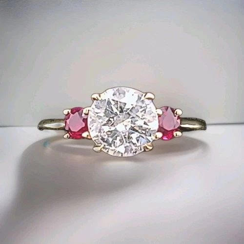 14K YELLOW GOLD ENGAGEMENT THREE STONE RING 1.64CT.NATURAL ROUND CUT DIAMOND: 14K YELLOW GOLD ENGAGEMENT THREE STONE RING 1.64CT.NATURAL ROUND CUT DIAMOND Gorgeous 14K yellow gold three-stone ring featuring a natural earth mined, clarity enhanced round-cut diamond center weighi