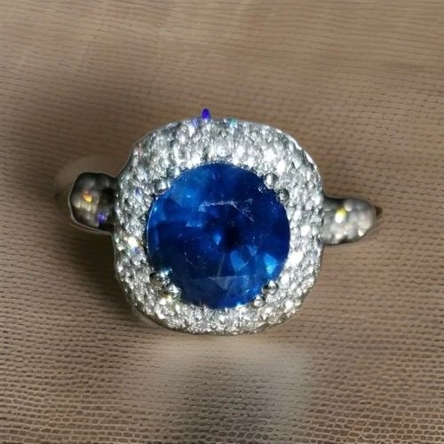 18K WHITE GOLD ENGAGEMENT RING 3.27CT. NATURAL BLUE SAPPHIRE ROUND SHAPE: 18K WHITE GOLD ENGAGEMENT RING 3.27CT. NATURAL BLUE SAPPHIRE ROUND SHAPE GORGEOUS 18K WHITE & YELLOW GOLD natural blue Sapphire round shape center weight 2.01ct. size 8.1mm very nice rich royal blue c